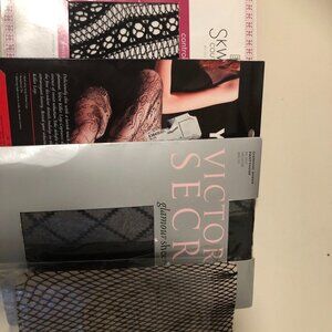 Bundle of queen size patterned pantihose.